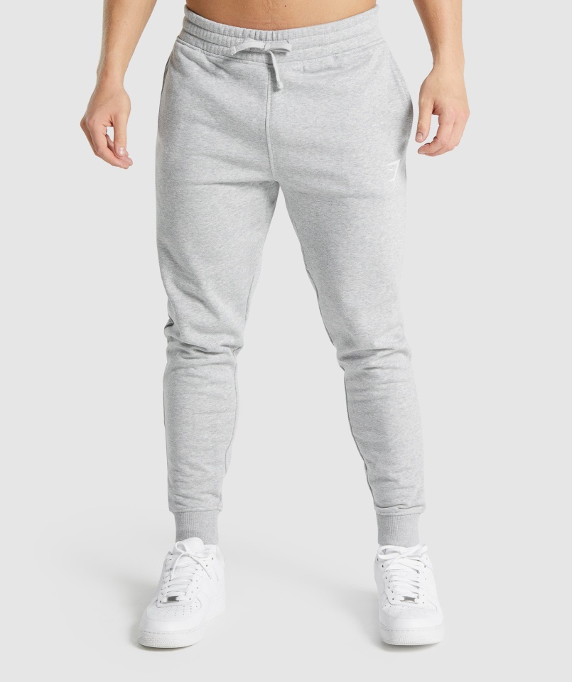 Joggers Gymshark Gris Claro Core Jaspeado Con Escudo