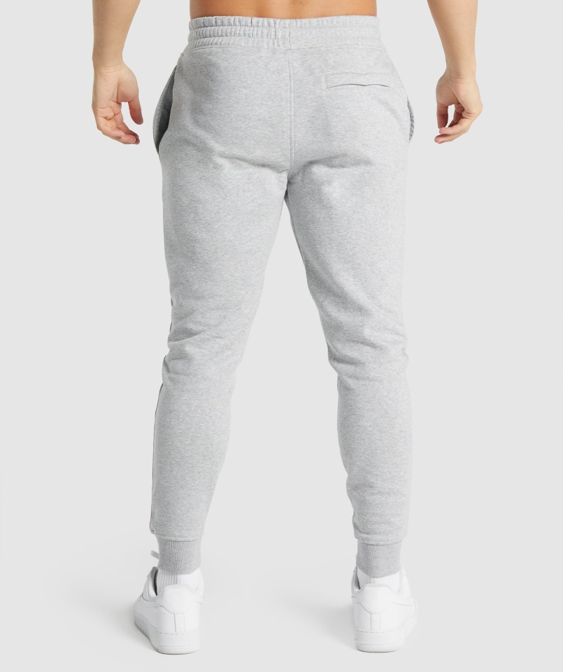 Joggers Gymshark Gris Claro Core Jaspeado Con Escudo