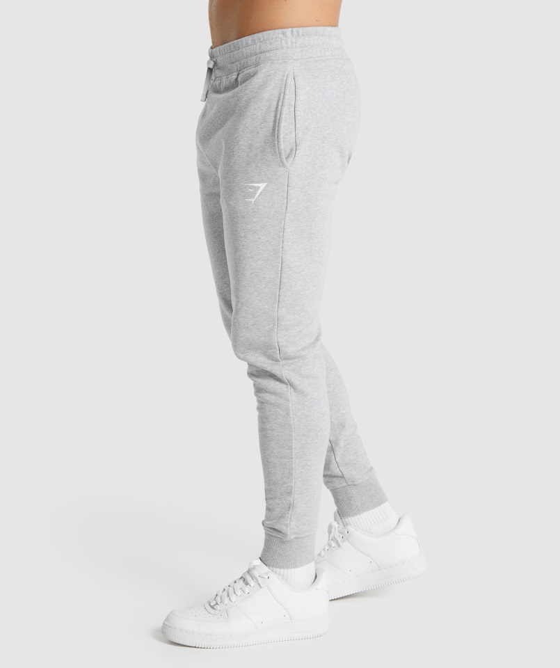 Joggers Gymshark Gris Claro Core Jaspeado Con Escudo