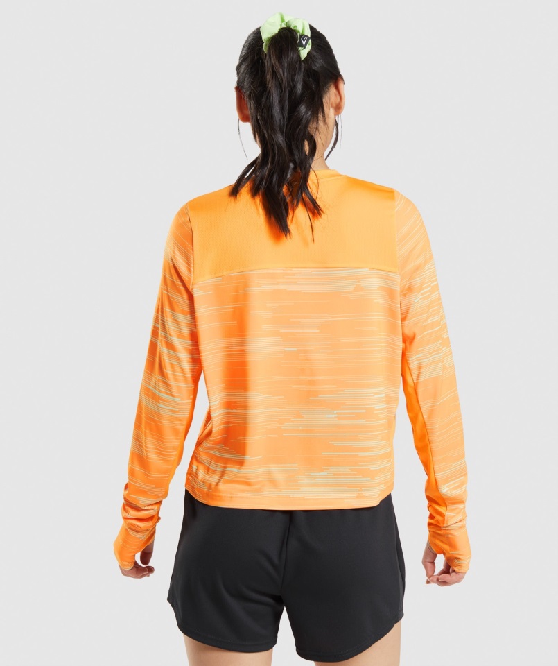 Camiseta Deportiva Holgada De Manga Larga Con Estampado Naranja Gymshark