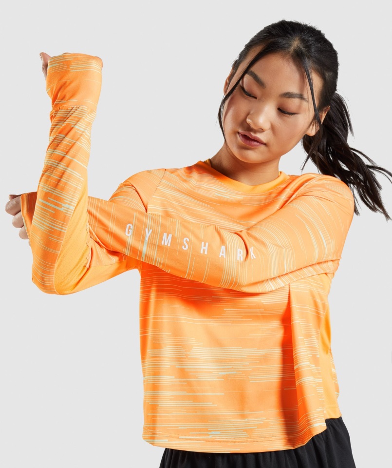 Camiseta Deportiva Holgada De Manga Larga Con Estampado Naranja Gymshark